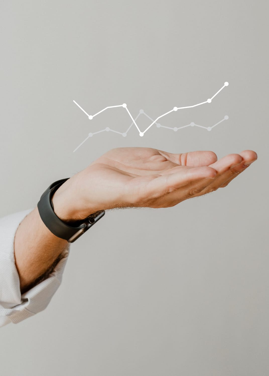 a hand holding an investment graph a hand holding an investment graph