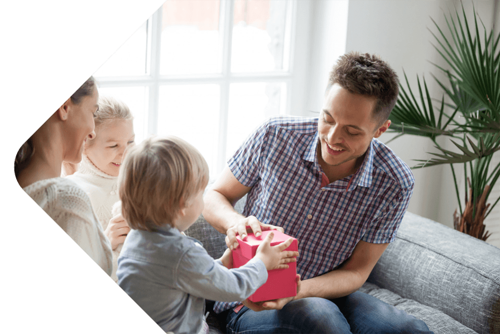 Father giving gift to child