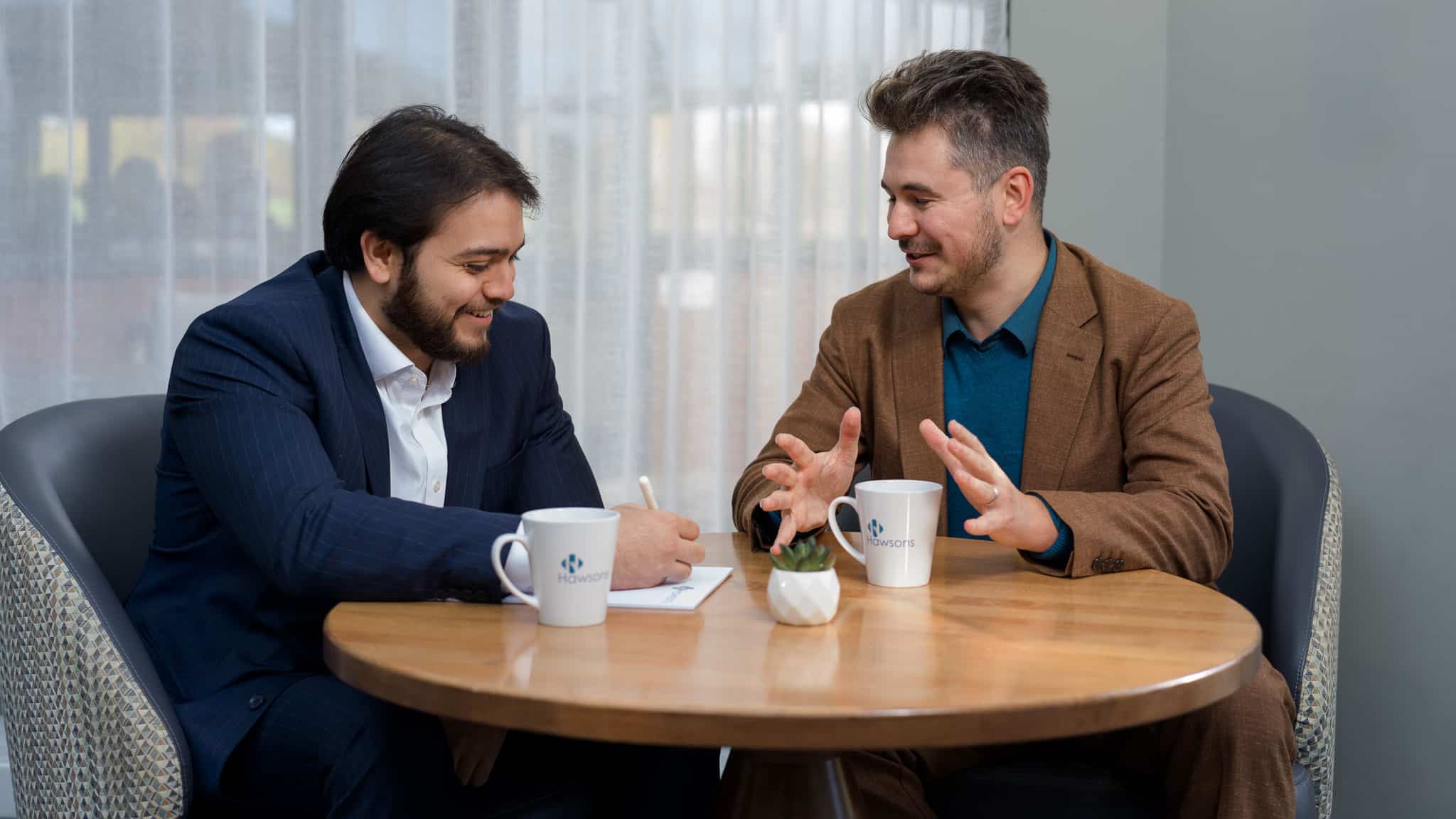 Luke Gamblin and Gareth Davies in a meeting