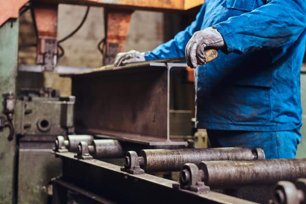 A manufacturing worker using some machinery